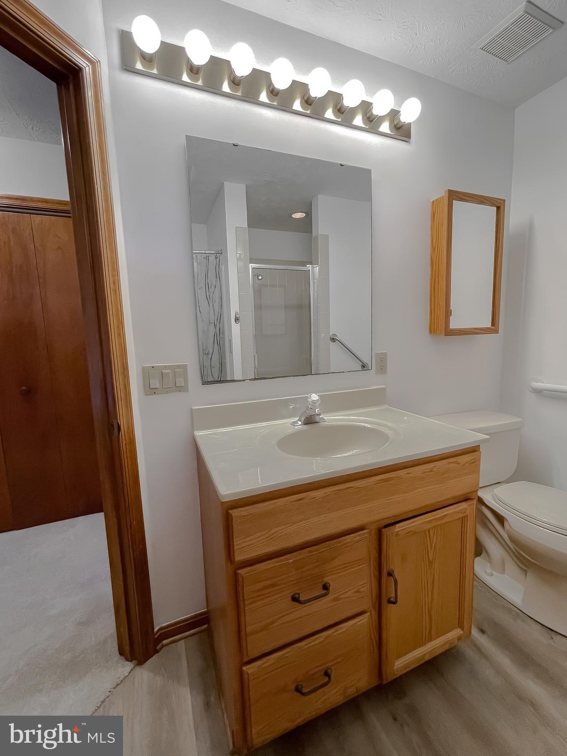 44059 Fieldstone Way California, MD 20619 - Photo 28 of 42 a bathroom with a sink a toilet and mirror