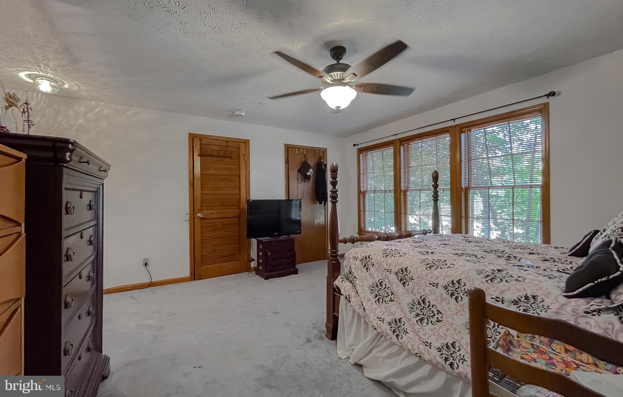 44059 Fieldstone Way California, MD 20619 - Photo 32 of 42 a bed room with a bed and a television