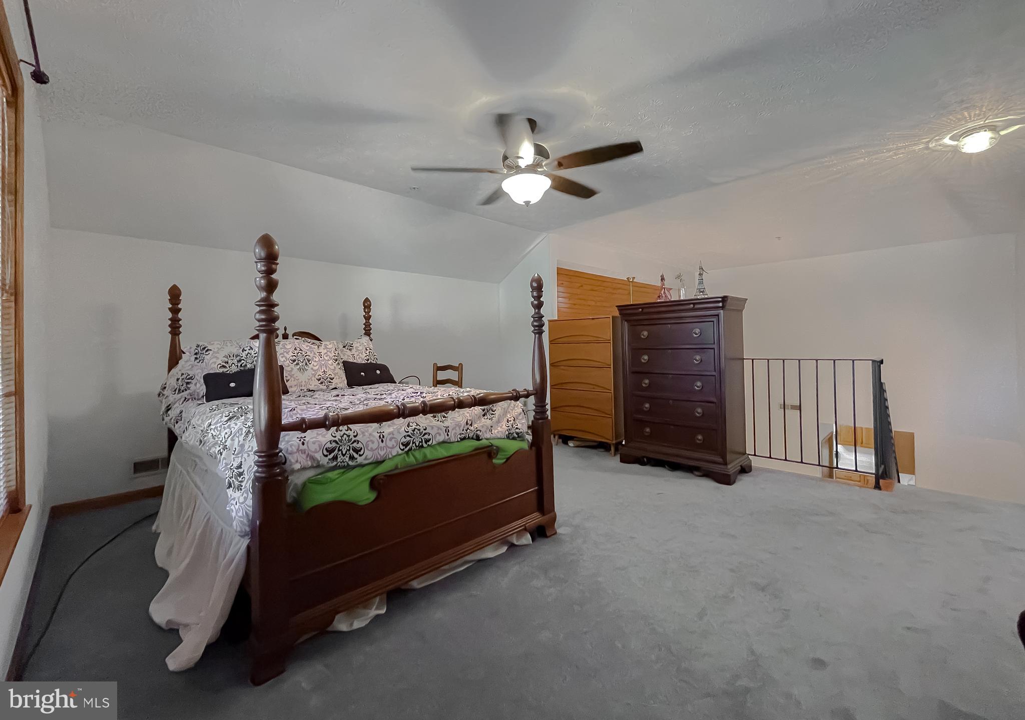44059 Fieldstone Way California, MD 20619 - Photo 33 of 42 a bedroom with a bed and a ceiling fan