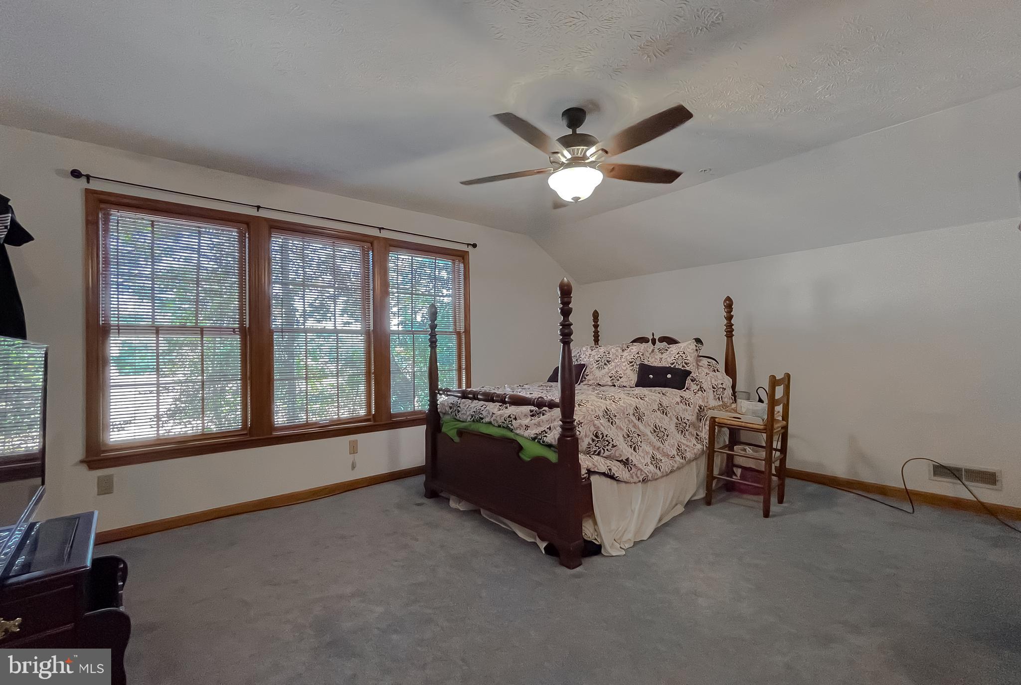 44059 Fieldstone Way California, MD 20619 - Photo 6 of 42 a bed room with a bed and a large window