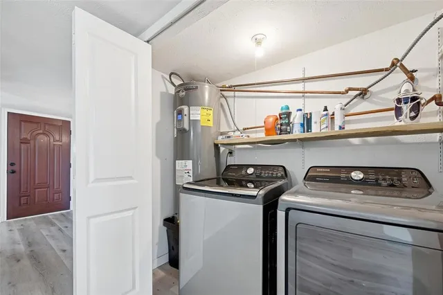 a utility room with washer and dryer