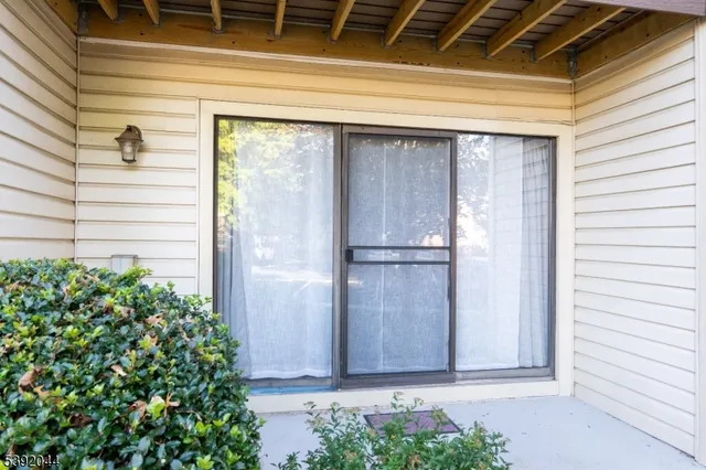 a view of a door and a window