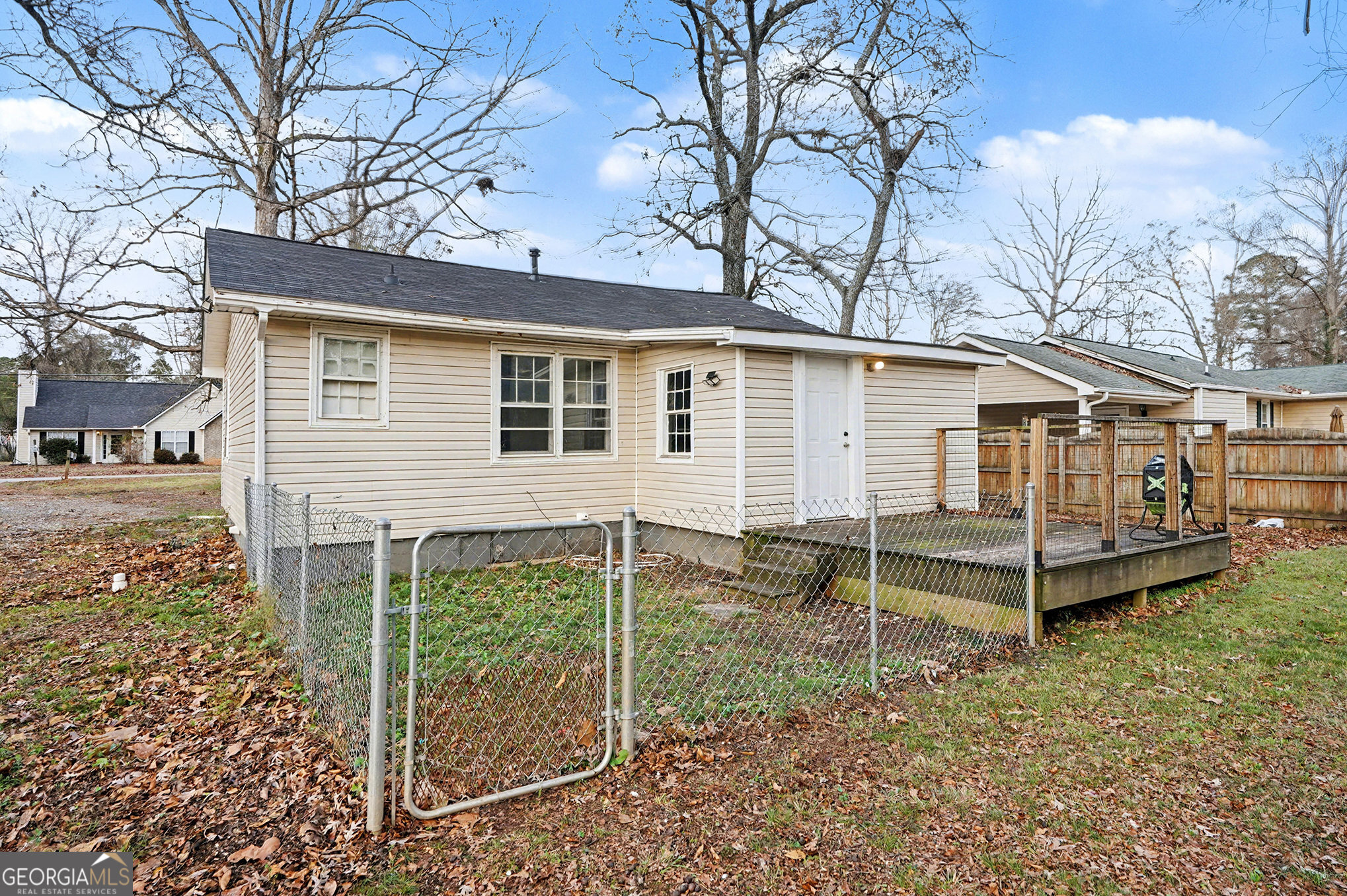 112 Oak Avenue Griffin, GA 30224 - Photo 16 of 16 a view of a house with a yard and wooden fence