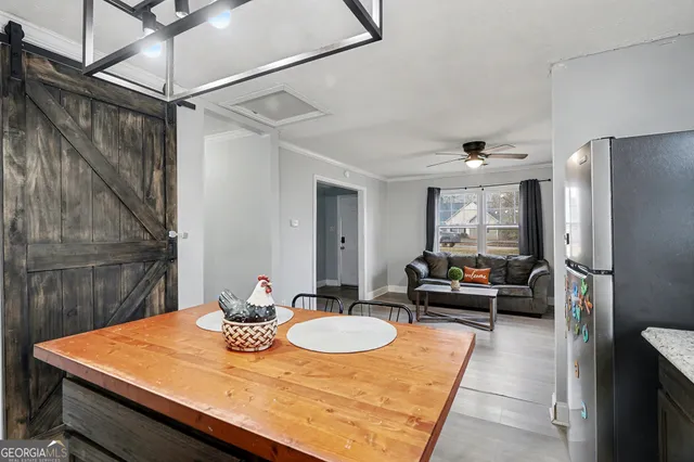 a kitchen with a table and chairs in it