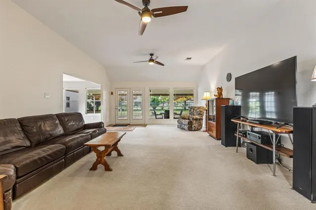 a living room with furniture and a rug
