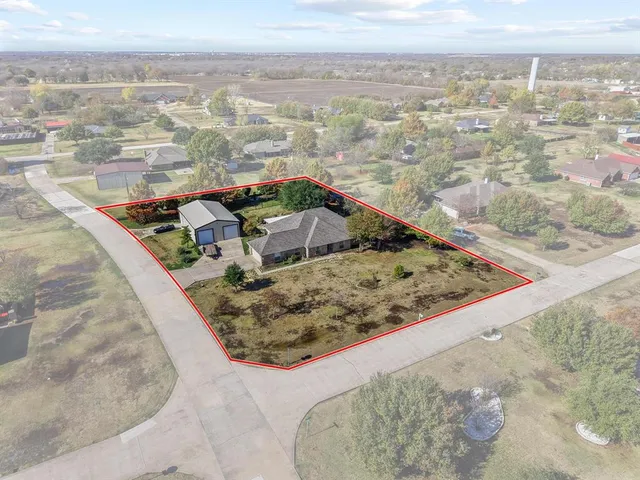 a view of a backyard with barbeque grill