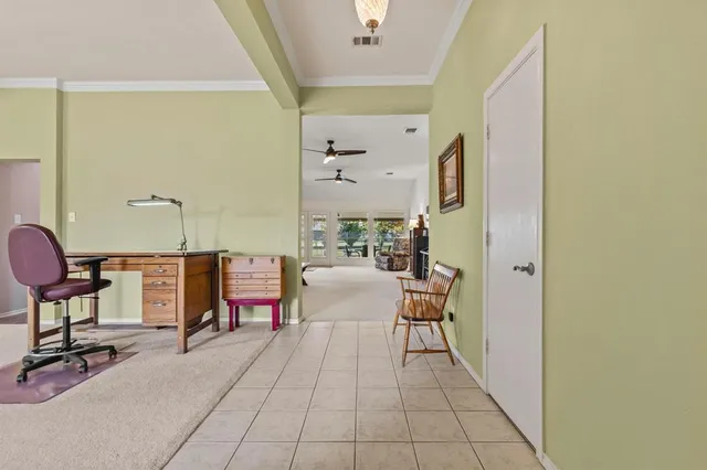 a bedroom with a bed and a desk