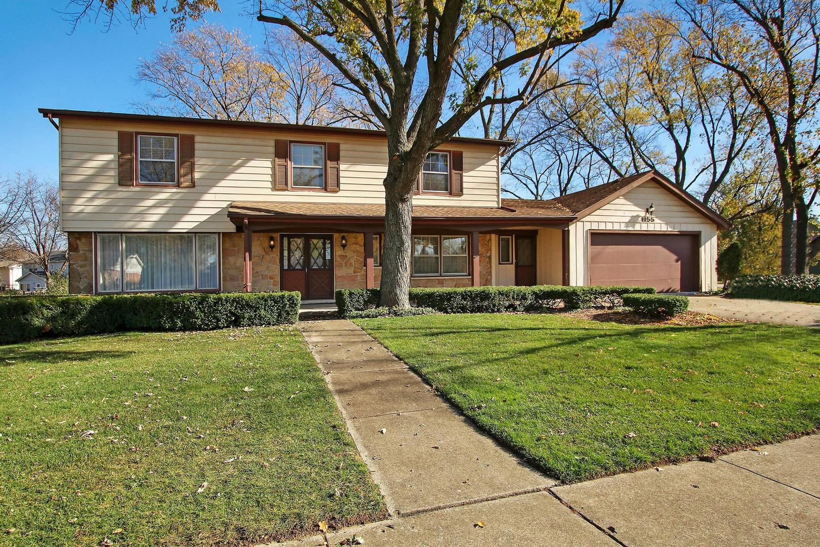 1155 Cayuga Drive Northbrook, IL 60062 - Photo 1 of 28 a front view of a house with a yard