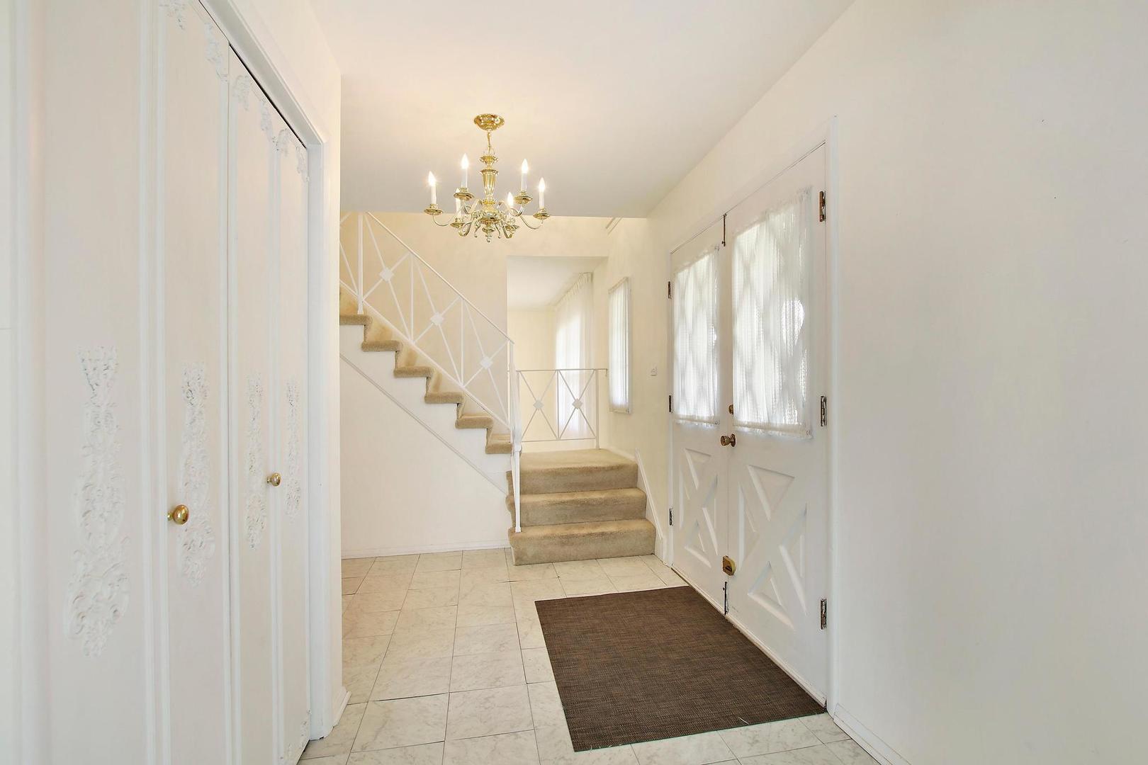 1155 Cayuga Drive Northbrook, IL 60062 - Photo 2 of 28 a view of a hallway with entryway and wooden floor