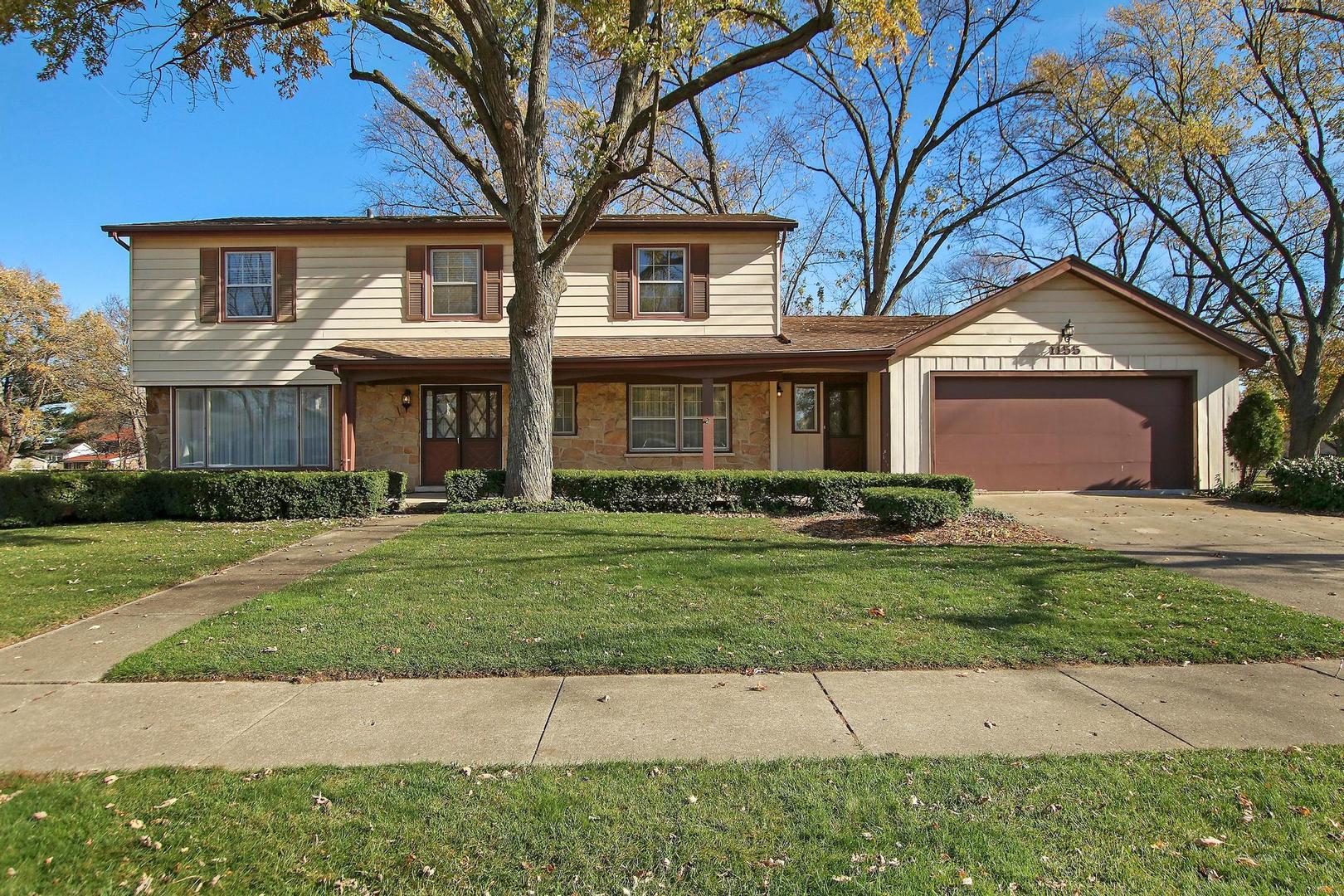 1155 Cayuga Drive Northbrook, IL 60062 - Photo 27 of 28 a front view of a house with a yard