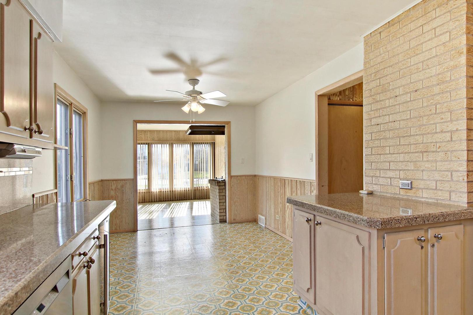 1155 Cayuga Drive Northbrook, IL 60062 - Photo 9 of 28 a view of a kitchen with a sink and a window