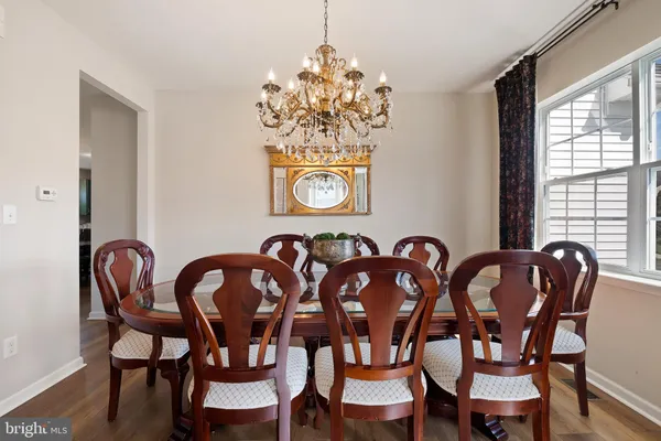 a dining room with furniture and window