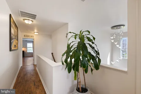 a bedroom with a bed window and a couch