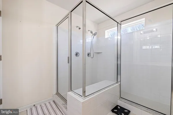 a bathroom with a sink double vanity and a mirror