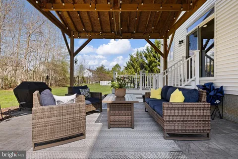 a view of a chairs and table in the patio