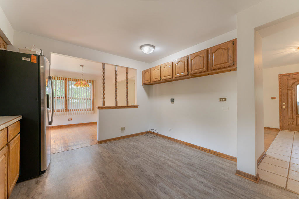 14322 McCarthy Road Lemont, IL 60439 - Photo 11 of 37 a view of empty room with wooden floor and fan
