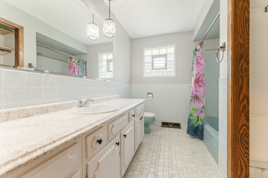 14322 McCarthy Road Lemont, IL 60439 - Photo 17 of 37 a spacious bathroom with a sink a vanity and a mirror