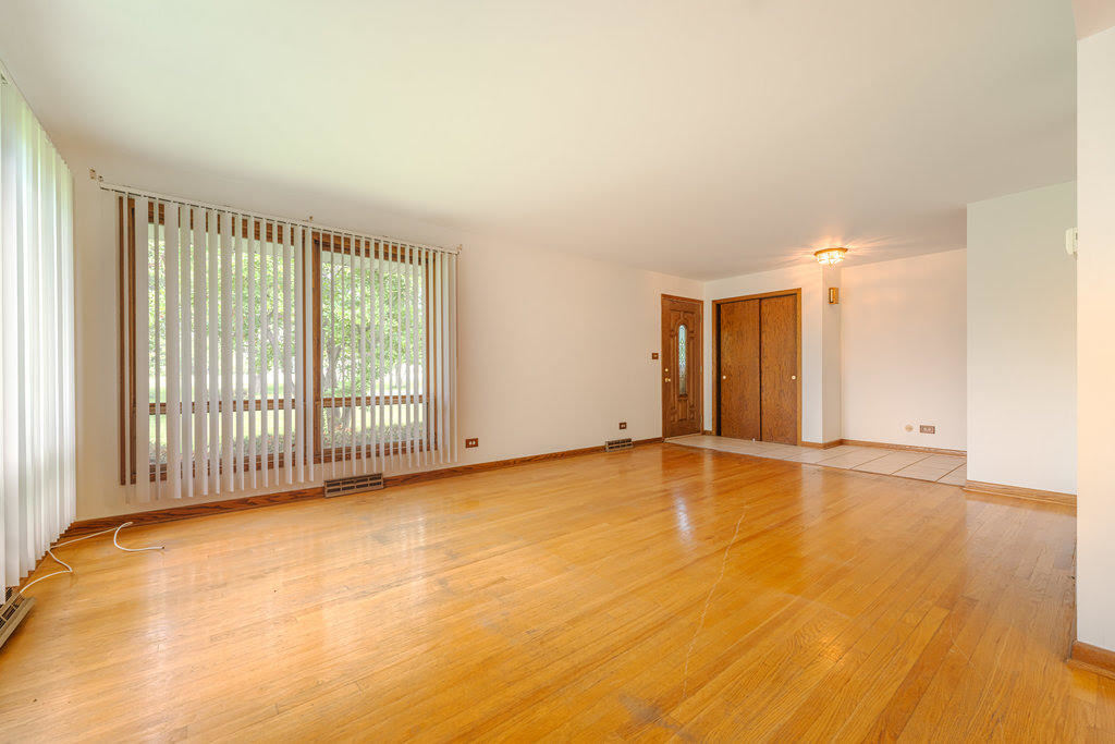 14322 McCarthy Road Lemont, IL 60439 - Photo 2 of 37 a view of an empty room with a window