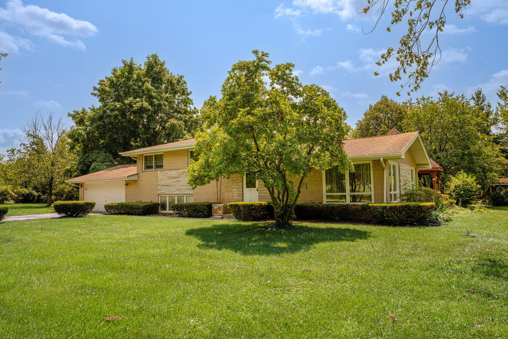 14322 McCarthy Road Lemont, IL 60439 - Photo 22 of 37 a view of a house with a yard