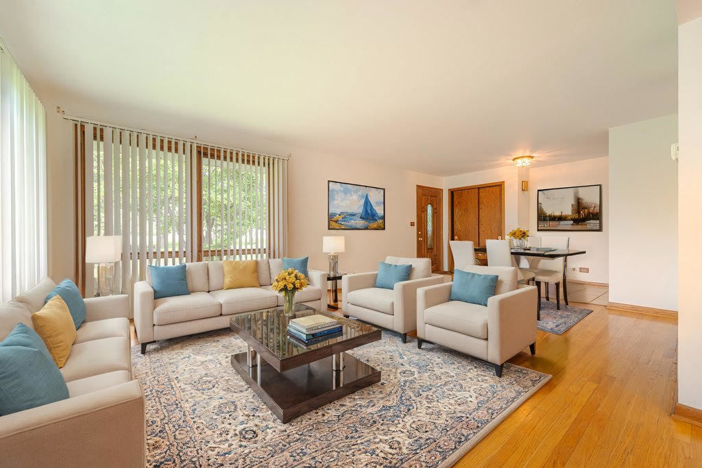 14322 McCarthy Road Lemont, IL 60439 - Photo 3 of 37 a living room with furniture wooden floor and a large window