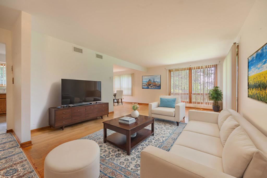 14322 McCarthy Road Lemont, IL 60439 - Photo 5 of 37 a living room with furniture and a flat screen tv