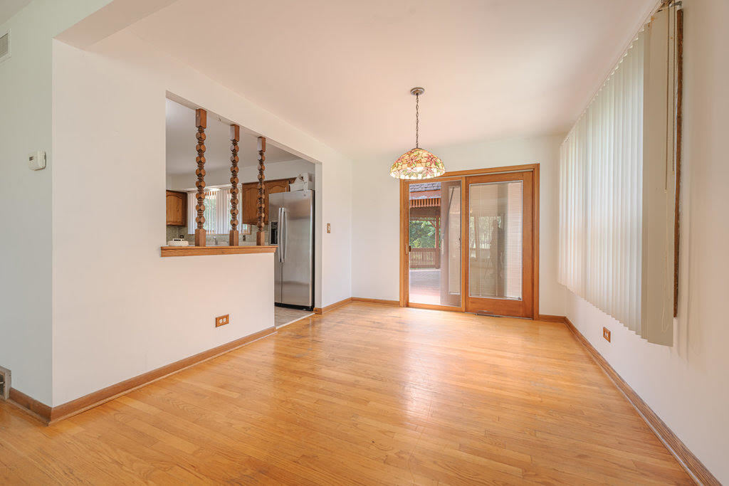 14322 McCarthy Road Lemont, IL 60439 - Photo 6 of 37 an empty room with windows