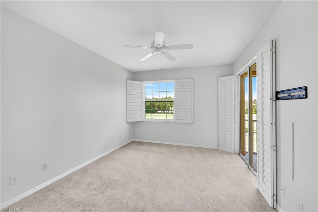 2015 Crestview Way, Unit 17B Naples, FL 34119 - Photo 12 of 29 a view of an empty room with a window