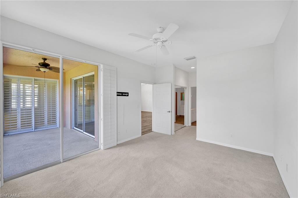 2015 Crestview Way, Unit 17B Naples, FL 34119 - Photo 13 of 29 a view of empty room with wooden floor and fan