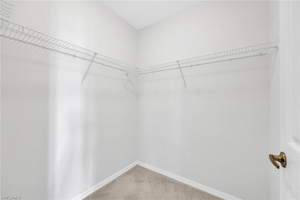 2015 Crestview Way, Unit 17B Naples, FL 34119 - Photo 14 of 29 a view of a room with racks on the wall