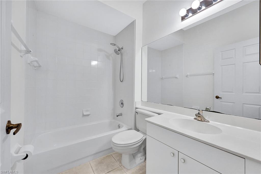 2015 Crestview Way, Unit 17B Naples, FL 34119 - Photo 17 of 29 a bathroom with a sink a toilet and shower