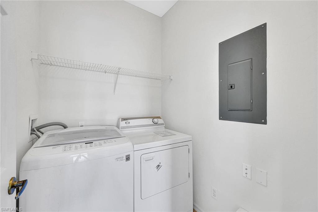2015 Crestview Way, Unit 17B Naples, FL 34119 - Photo 19 of 29 a utility room with dryer and washer
