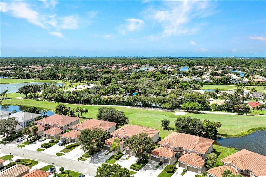 2015 Crestview Way, Unit 17B Naples, FL 34119 - Photo 2 of 29 an aerial view of a houses with yard and green space