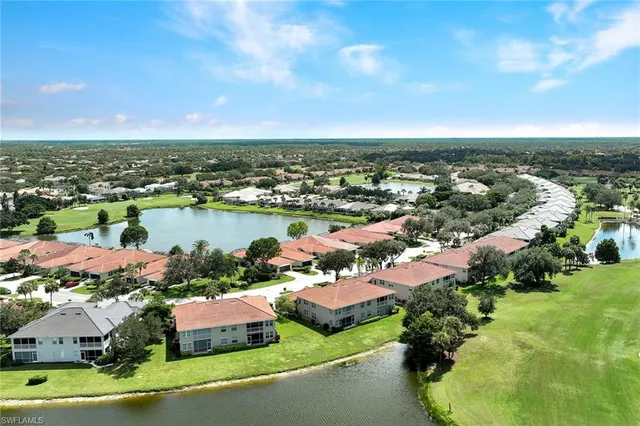 an aerial view of a house with yard swimming pool and outdoor seating