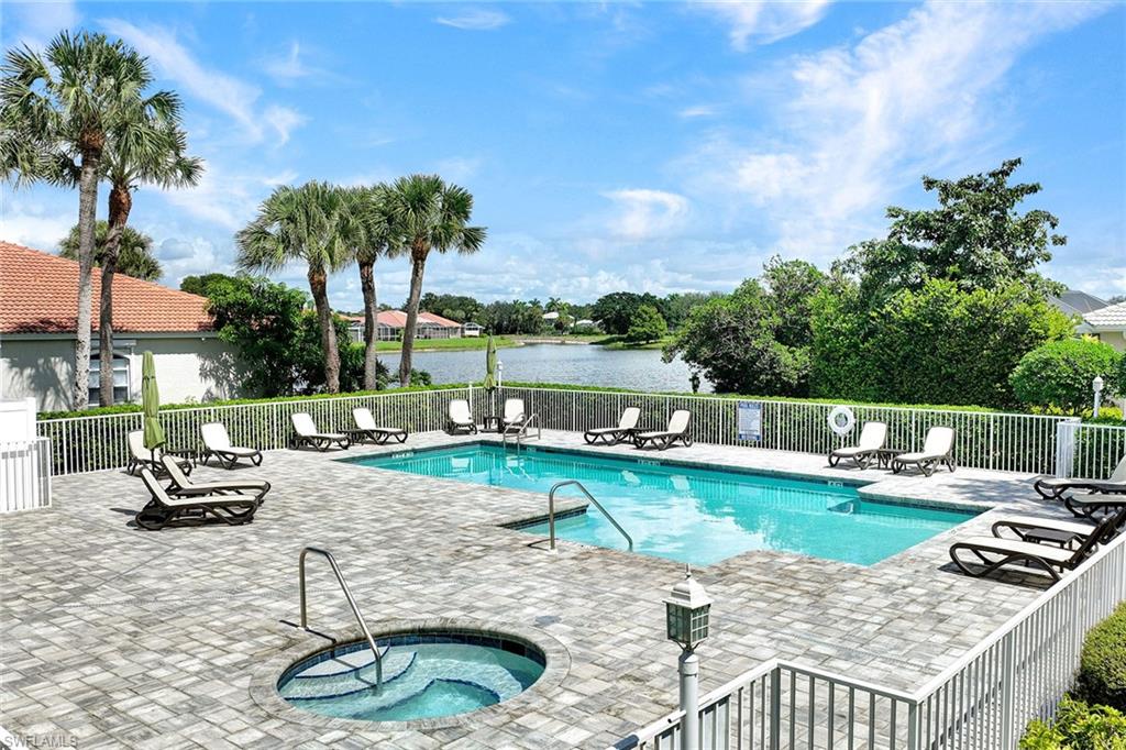 2015 Crestview Way, Unit 17B Naples, FL 34119 - Photo 29 of 29 a view of a swimming pool with a patio and a yard