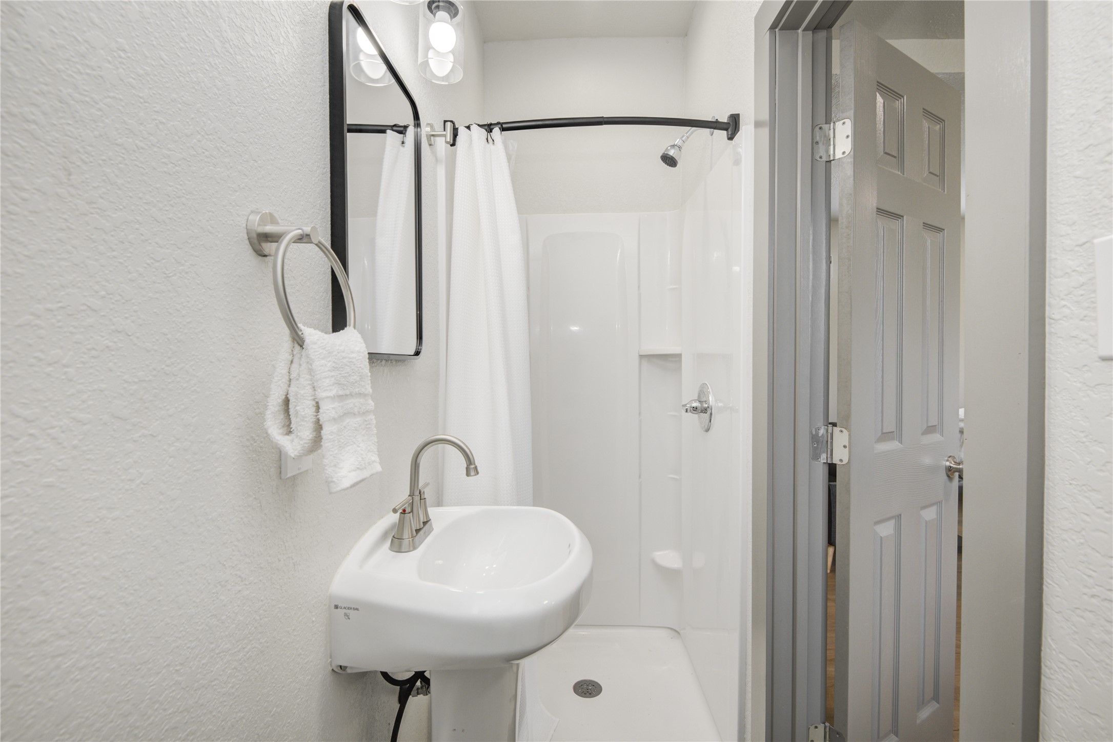 208 West 2nd Street Sweeny, TX 77480 - Photo 7 of 12 a bathroom with a sink a toilet and shower