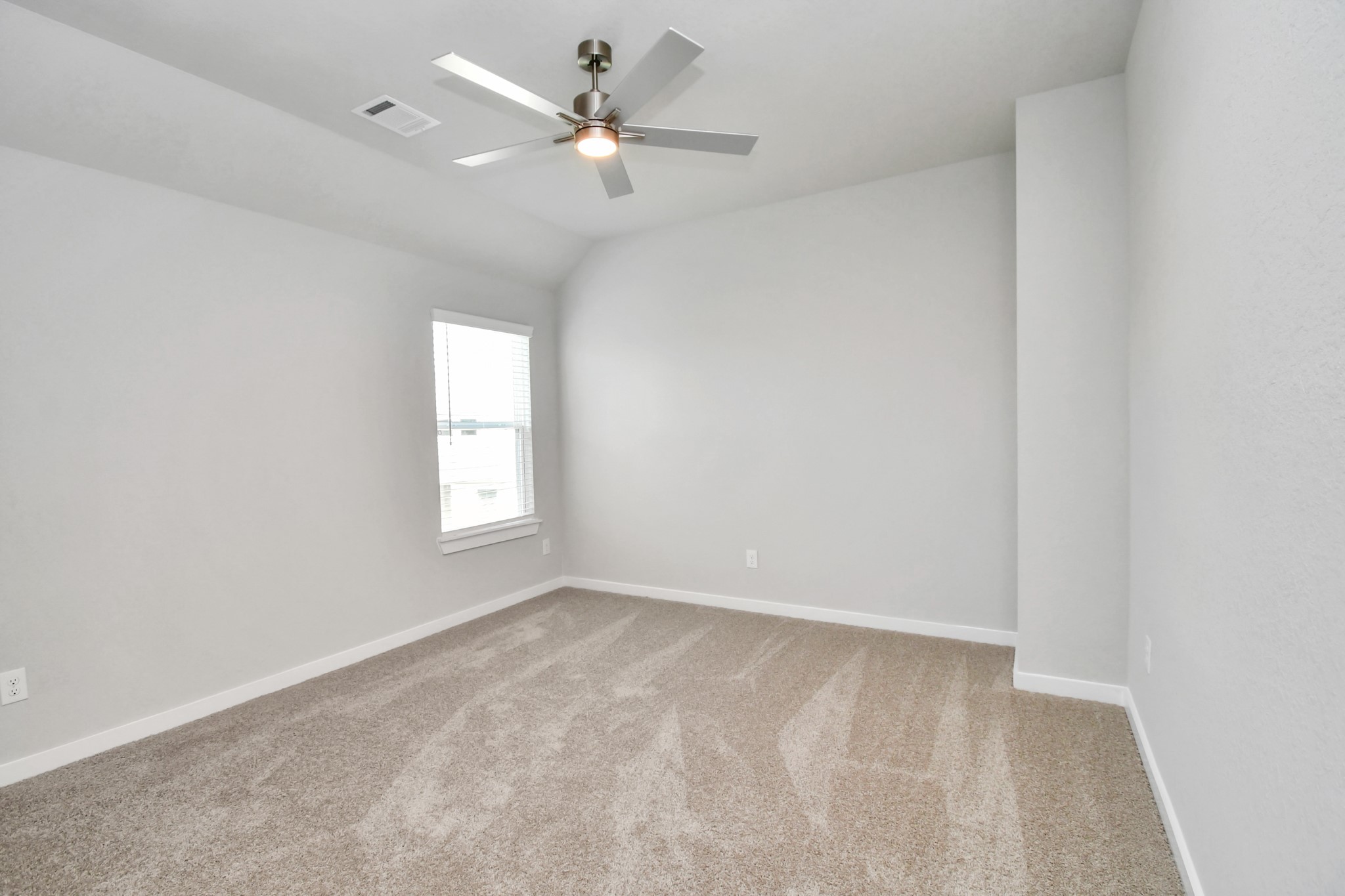 3106 Native Spg Drive Spring, TX 77373 - Photo 30 of 38 Secondary bedroom features plush carpeting, large windows that let in plenty of natural light, bright paint, and spacious closets. Sample photo of completed home with similar floor plan. Actual colors and selections may vary.