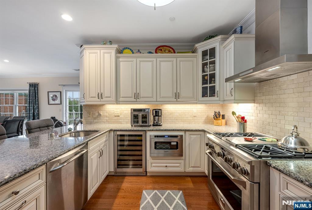 2310 Rio Vista Lane, Unit 2310 Northvale, NJ 07647 - Photo 11 of 49 a kitchen with stainless steel appliances granite countertop a stove sink and cabinets