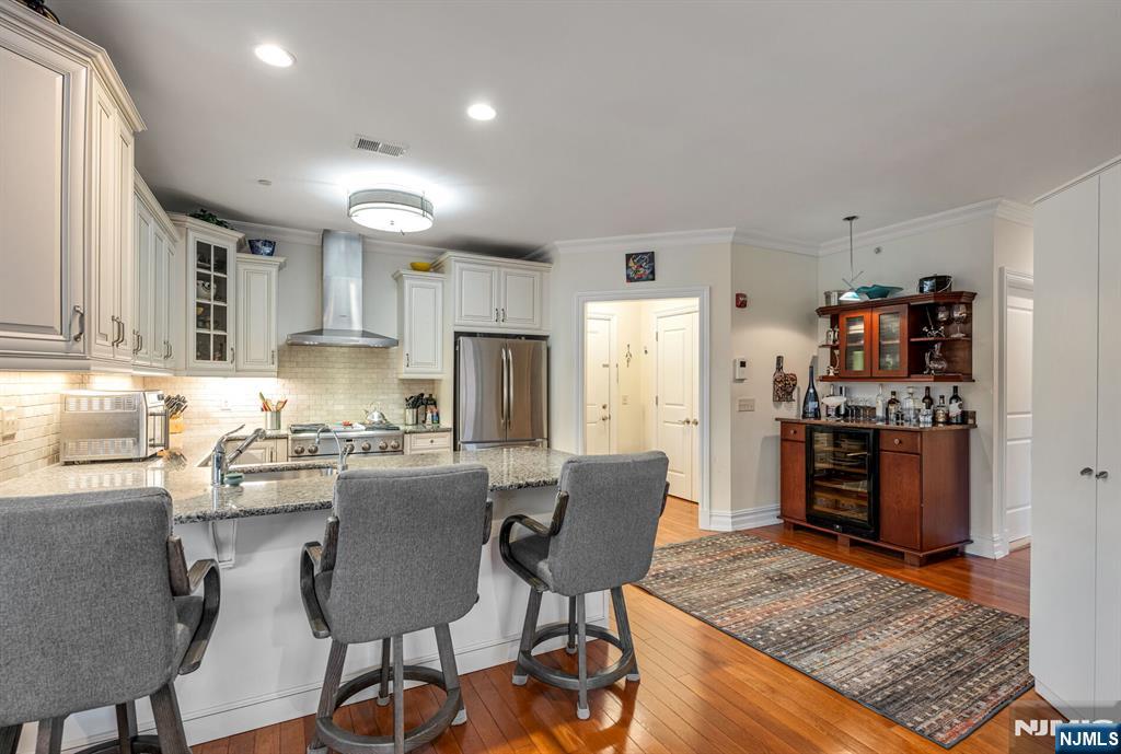 2310 Rio Vista Lane, Unit 2310 Northvale, NJ 07647 - Photo 12 of 49 a kitchen with stainless steel appliances granite countertop a refrigerator and stove top oven