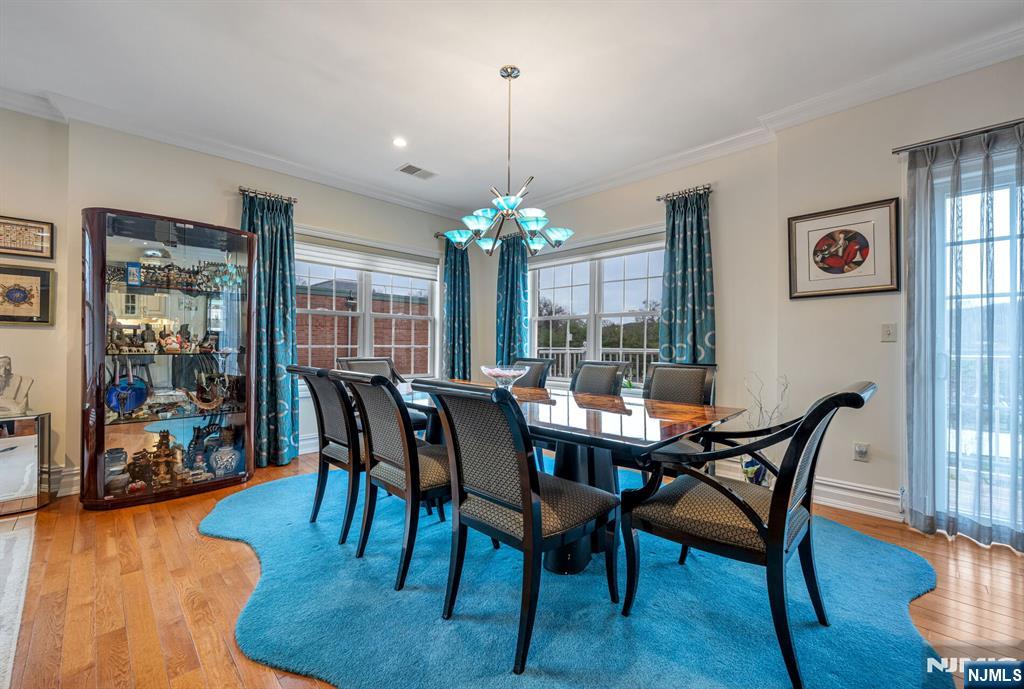 2310 Rio Vista Lane, Unit 2310 Northvale, NJ 07647 - Photo 18 of 49 a view of a dining room with furniture window and wooden floor