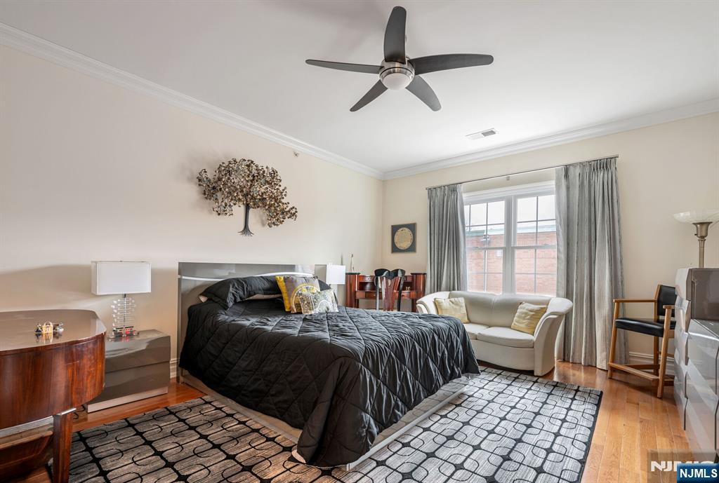 2310 Rio Vista Lane, Unit 2310 Northvale, NJ 07647 - Photo 19 of 49 a bedroom with a bed and wooden floor