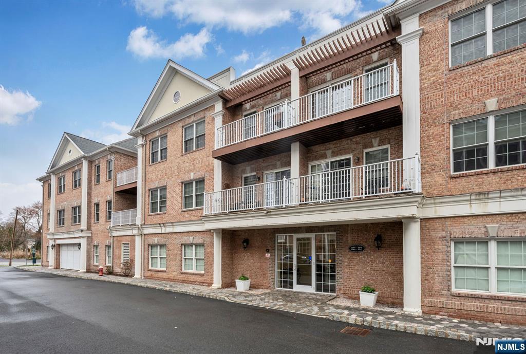 2310 Rio Vista Lane, Unit 2310 Northvale, NJ 07647 - Photo 2 of 49 a large building with a lot of windows