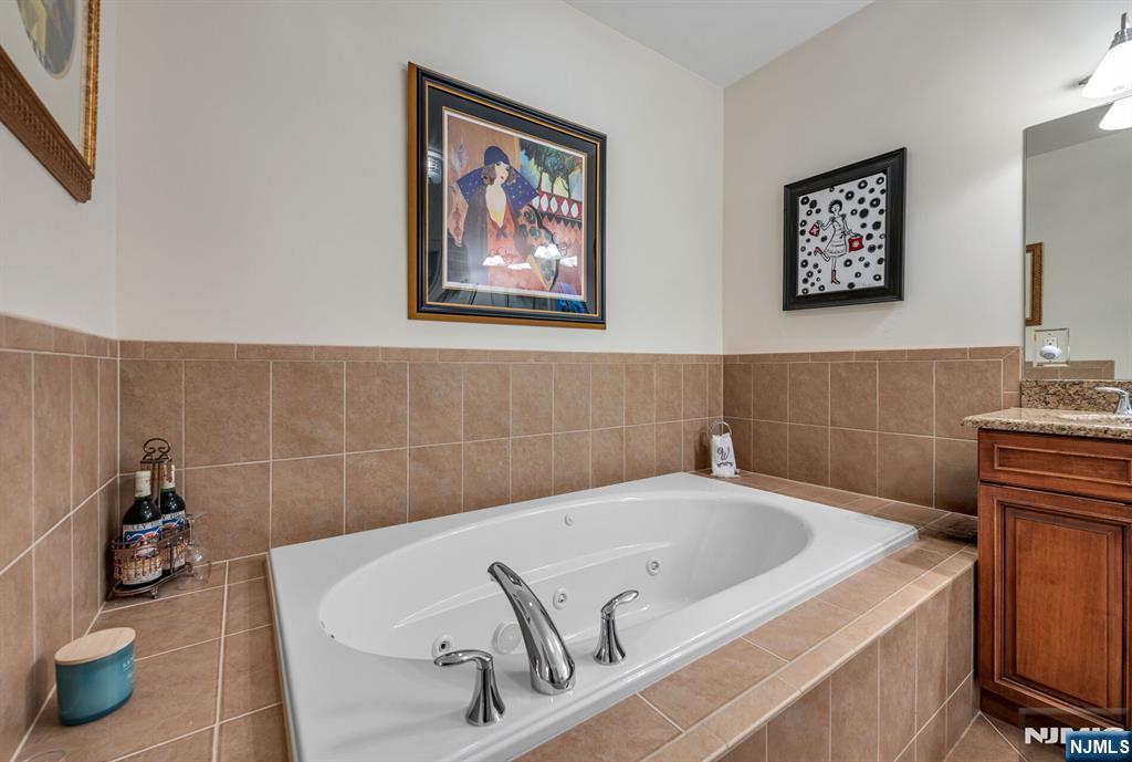 2310 Rio Vista Lane, Unit 2310 Northvale, NJ 07647 - Photo 23 of 49 a bathroom with a tub and sink