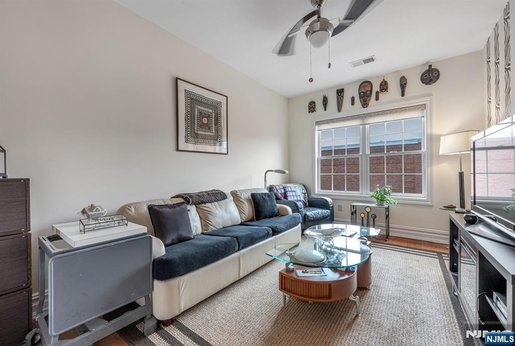 2310 Rio Vista Lane, Unit 2310 Northvale, NJ 07647 - Photo 25 of 49 a living room with furniture and a fireplace