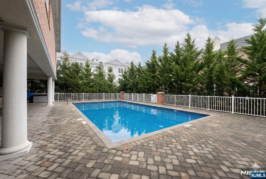 2310 Rio Vista Lane, Unit 2310 Northvale, NJ 07647 - Photo 48 of 49 a view of a swimming pool with a lounge chair