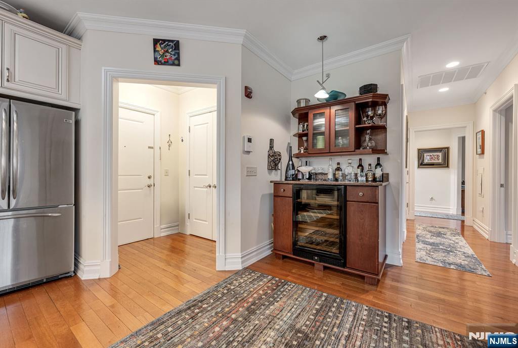 2310 Rio Vista Lane, Unit 2310 Northvale, NJ 07647 - Photo 7 of 49 a view of a kitchen with refrigerator and wooden floor