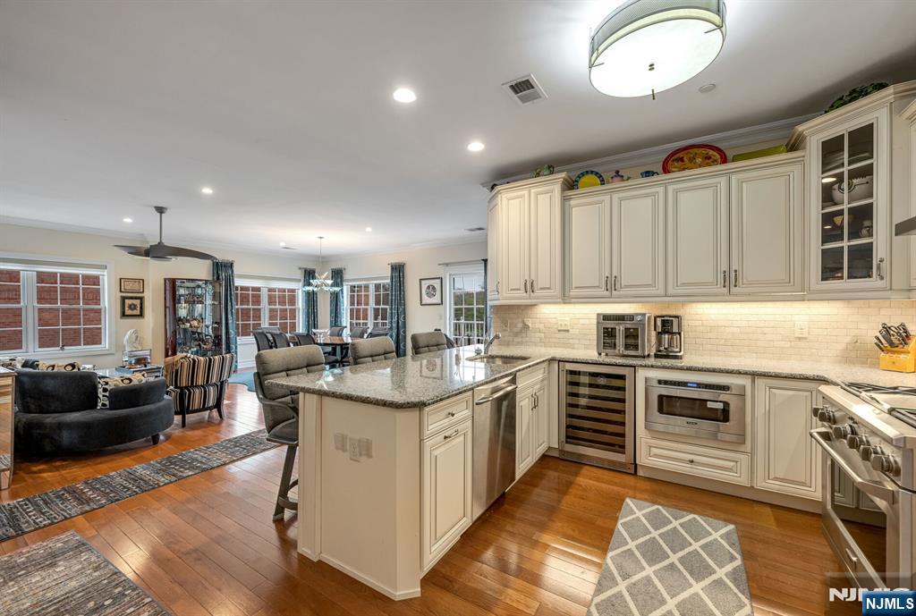 2310 Rio Vista Lane, Unit 2310 Northvale, NJ 07647 - Photo 8 of 49 a kitchen with stainless steel appliances granite countertop a stove and cabinets