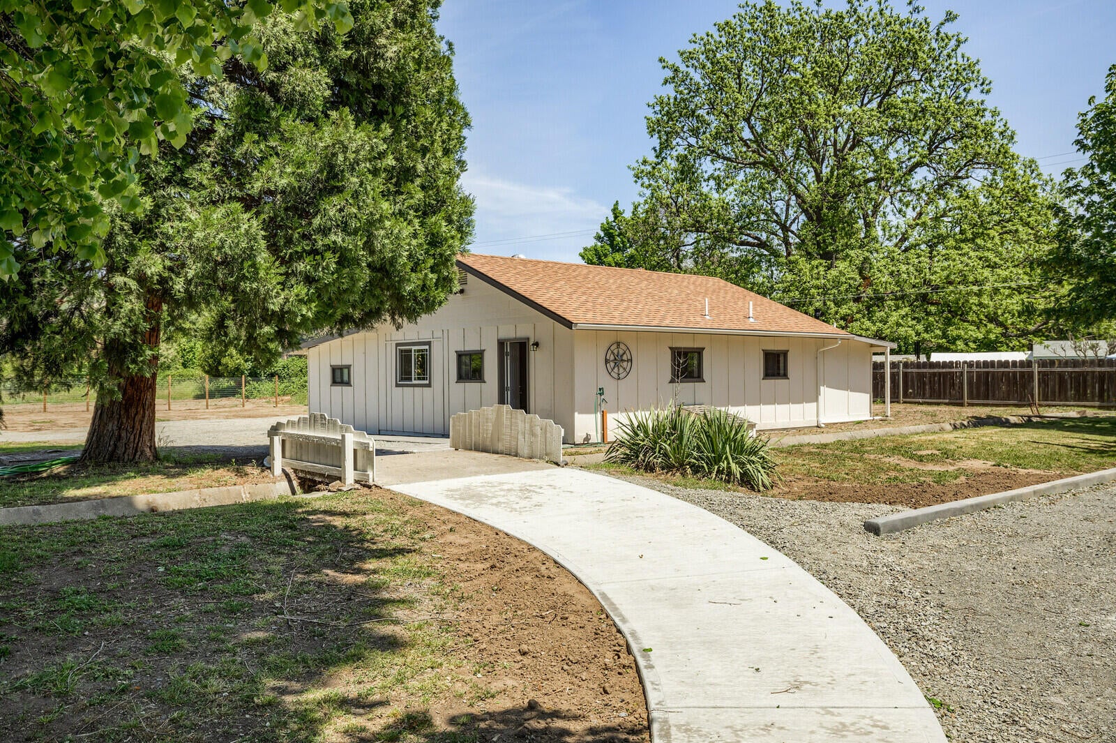 2922 Lower River Road Grants Pass, OR 97526 - Photo 61 of 72 Concrete walkway over irrigation ditch to multi purpose room