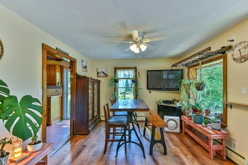 161 Gore Road Webster, MA 01570 - Photo 16 of 42 a living room with furniture fireplace and wooden floor