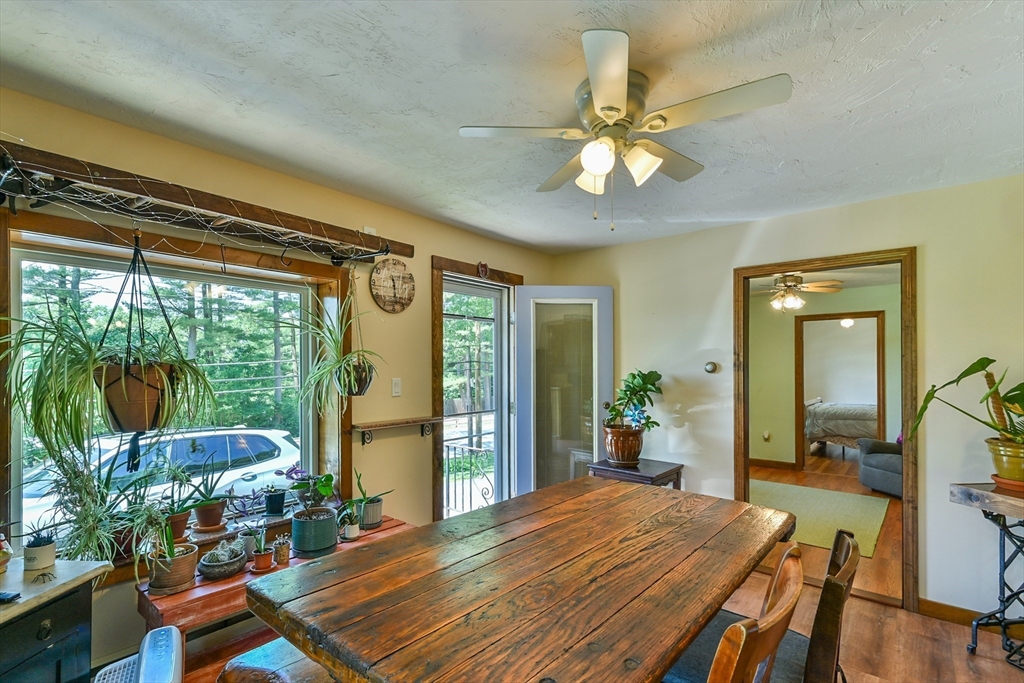 161 Gore Road Webster, MA 01570 - Photo 19 of 42 a bedroom with a bed and large windows