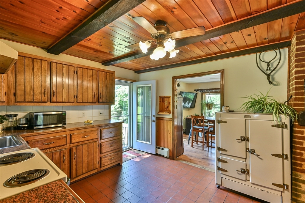 161 Gore Road Webster, MA 01570 - Photo 25 of 42 a kitchen that has a lot of cabinets in it